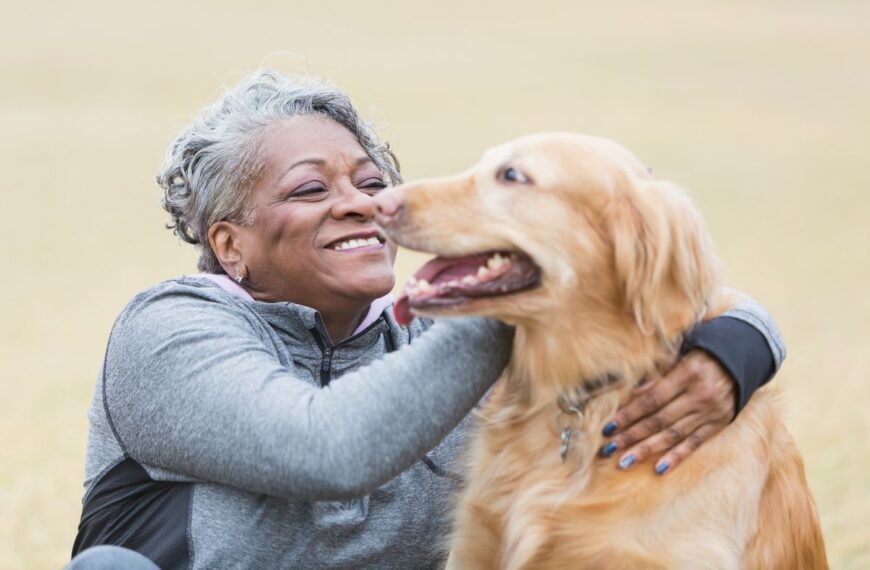 A woman enjoys time outdoors with her new pet dog.