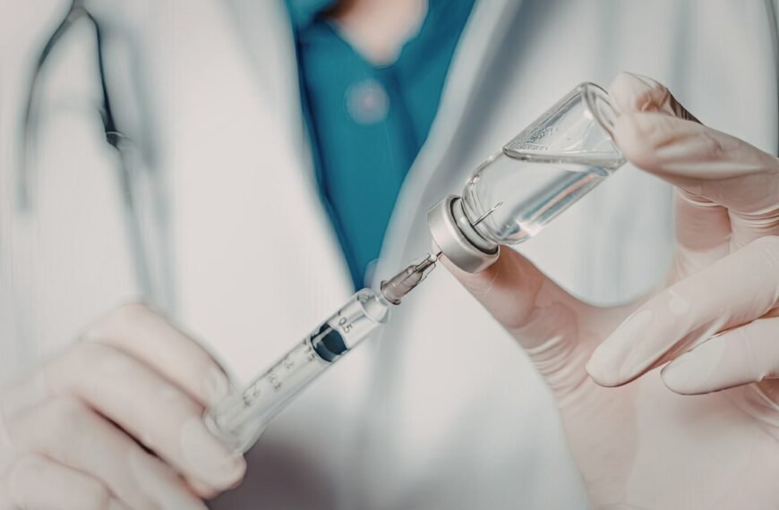 A veterinarian prepares a vaccine.